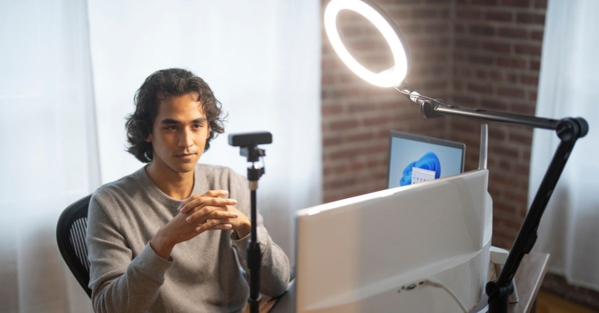 Person taking a computer video conference with a Kensington ProVc light ring and camera