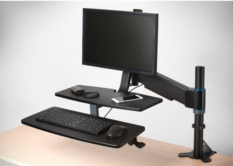 A desktop monitor attached to a monitor arm