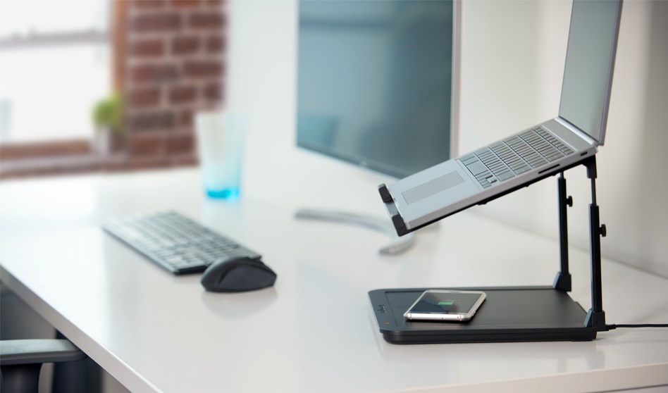 A Kensington® SmartFit® Laptop Riser with Qi Wireless Phone Charging Pad