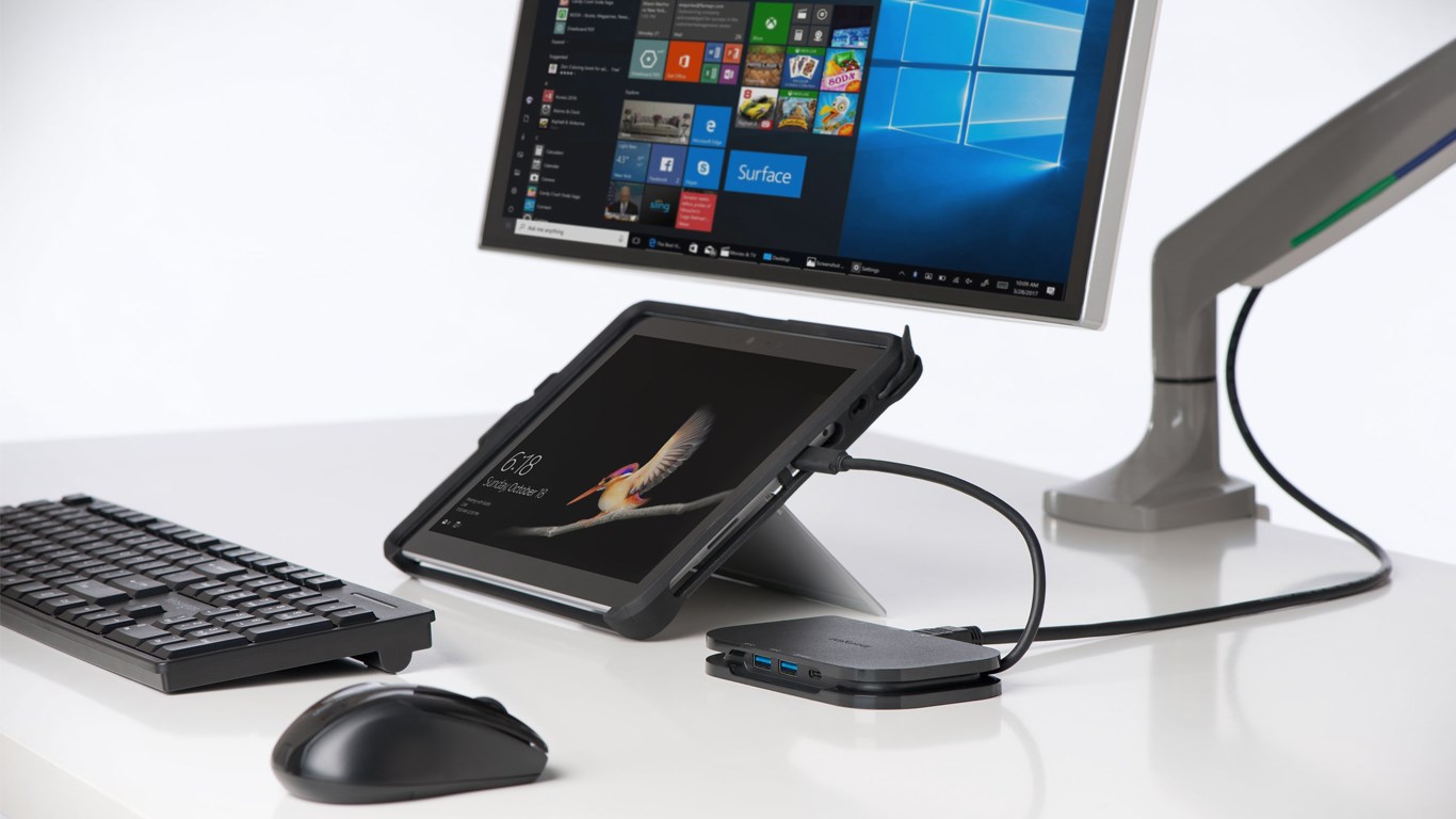 A monitor and a surface tablet connected with a docking station 