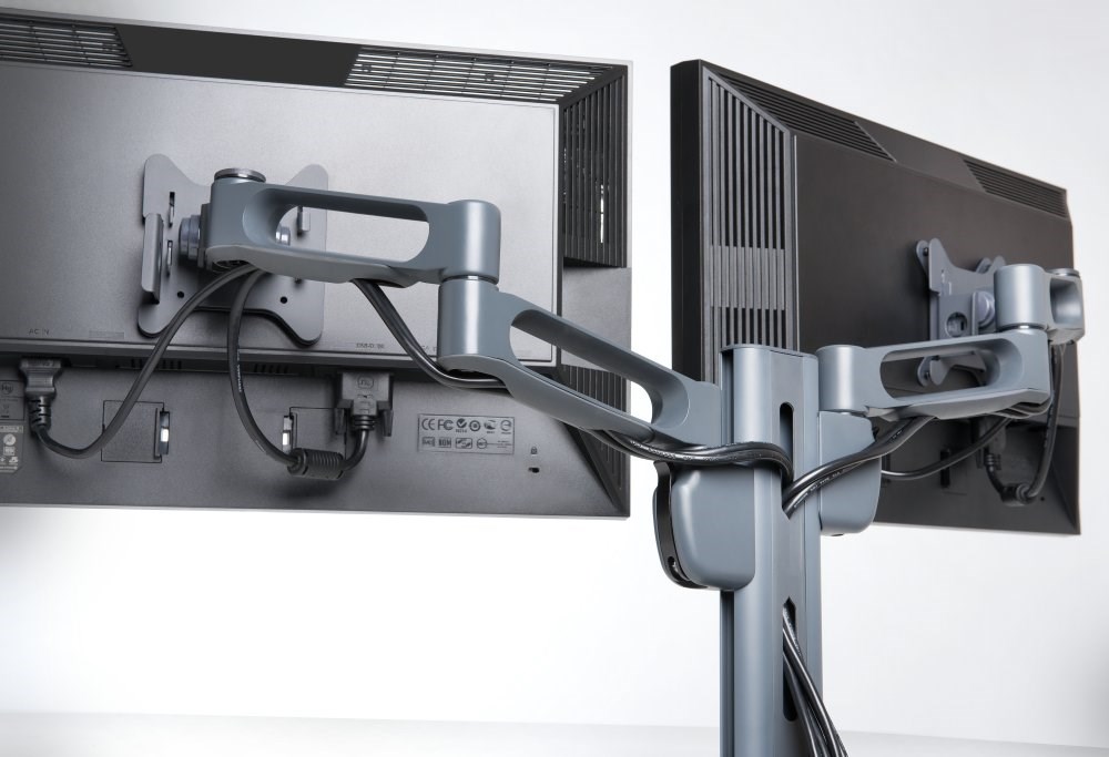 Two monitors attached to a Kensington monitor arm