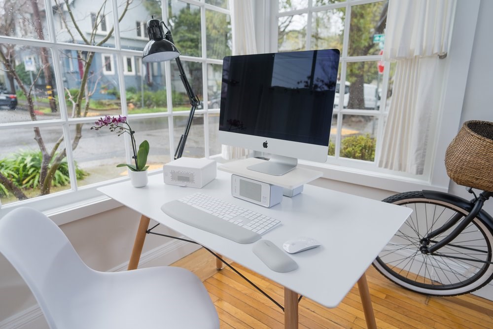 Home office setup with an iMac and a Kensington WellView monitor stand