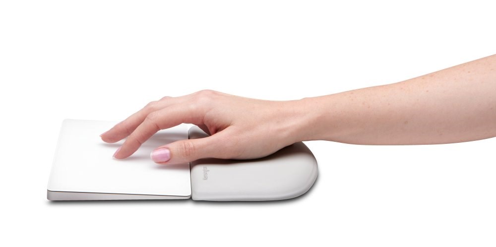 Person using a Kensington wrist rest with an Apple trackpad