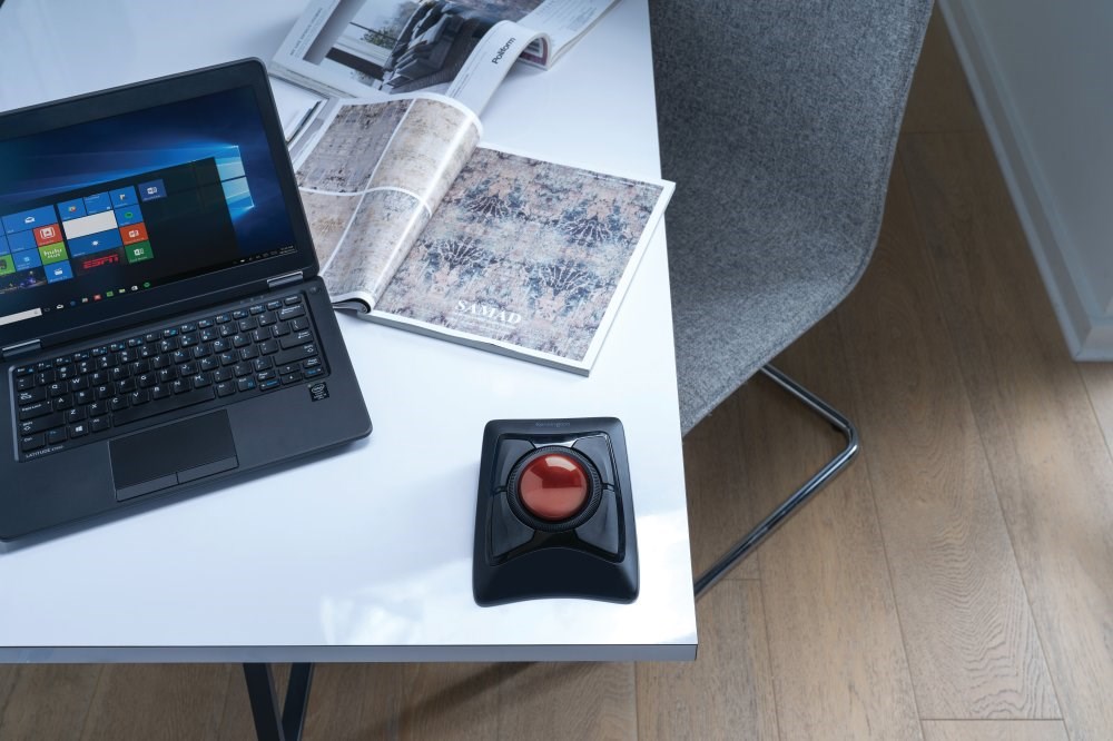 A Kensington trackball mouse in use with a laptop