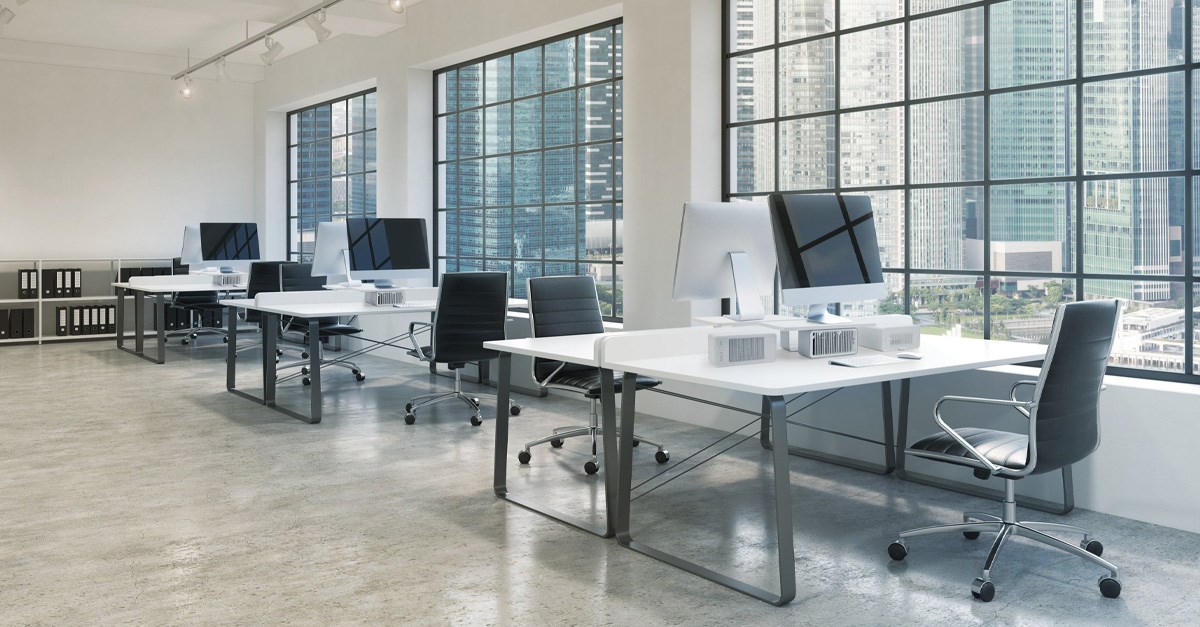 An office setup with iMac monitors setup with Kensington CoolView™ Wellness Monitor Stands