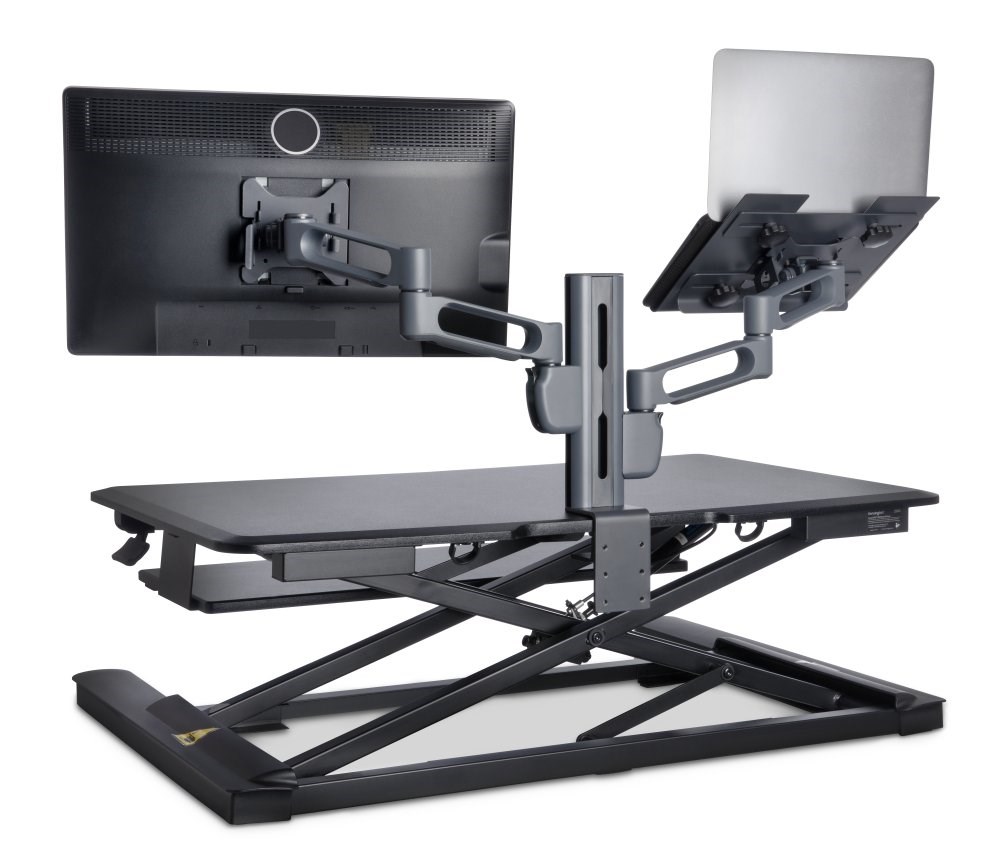 Kensington’s SmartFit monitor arms in use for a desktop computer and a laptop