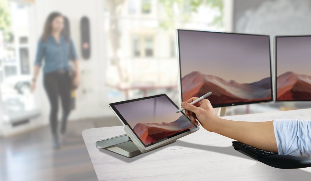 Person working in an office space with a Microsoft Surface Tablet