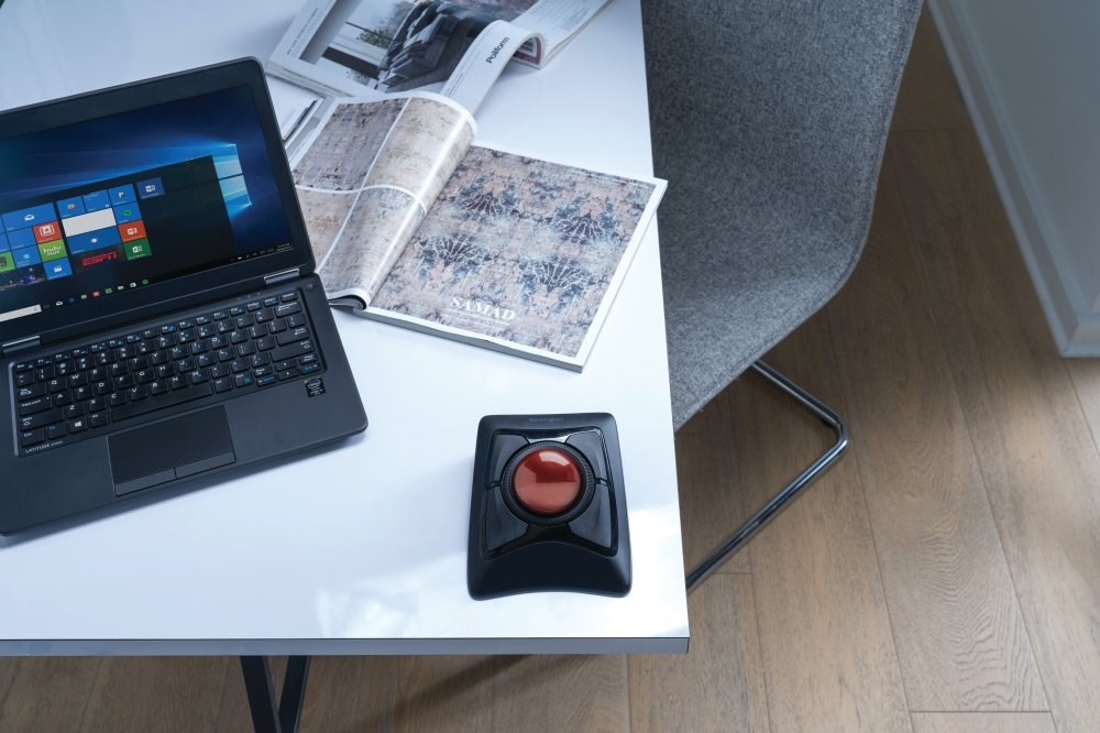 A Kensington Expert Mouse® Wireless Trackball in use with a laptop