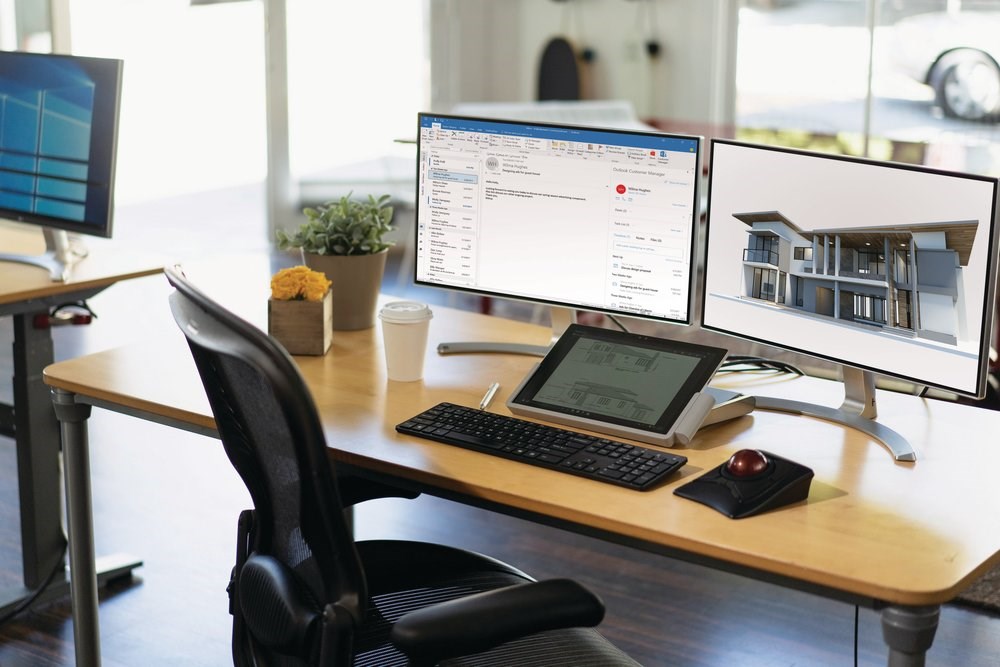 Dual monitor setup with a Surface tablet and docking station and an Expert trackball mouse