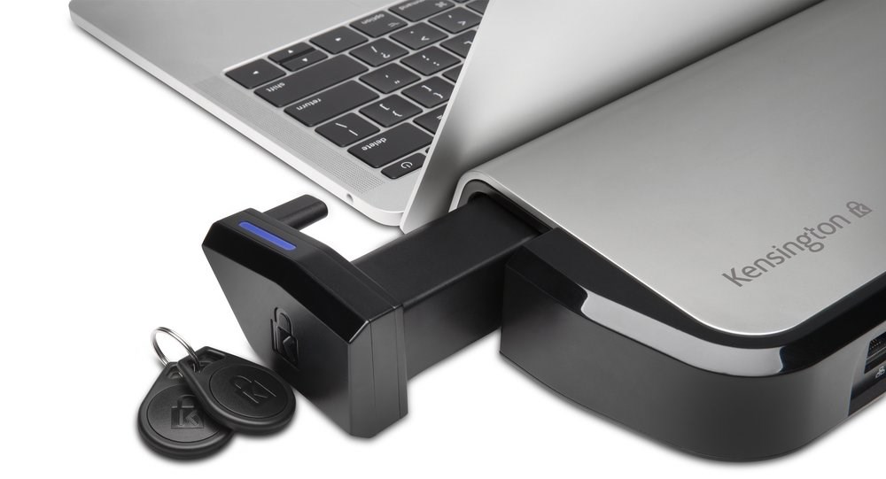A MacBook laptop connected to a Kensington Docking Stations with K-Fob™ Smart Lock