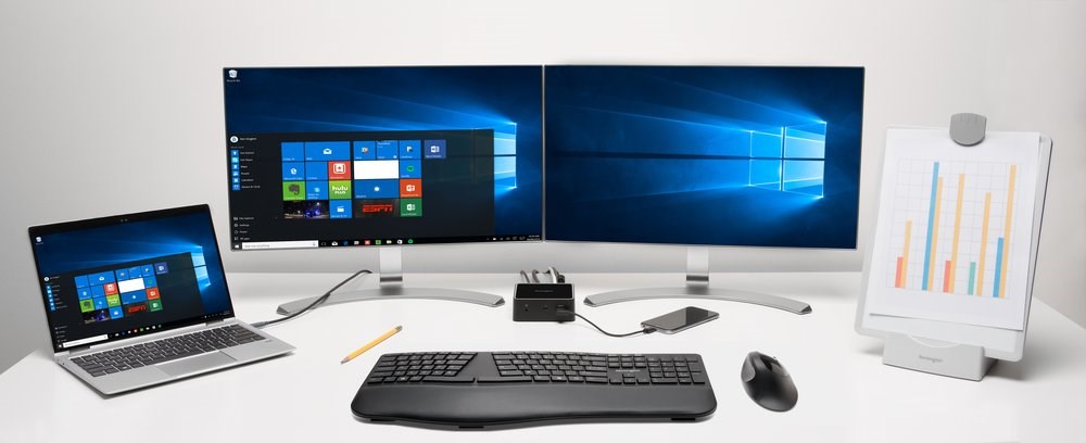 Desk setup with a Kensington keyboard, mouse, docking station, and copyholder