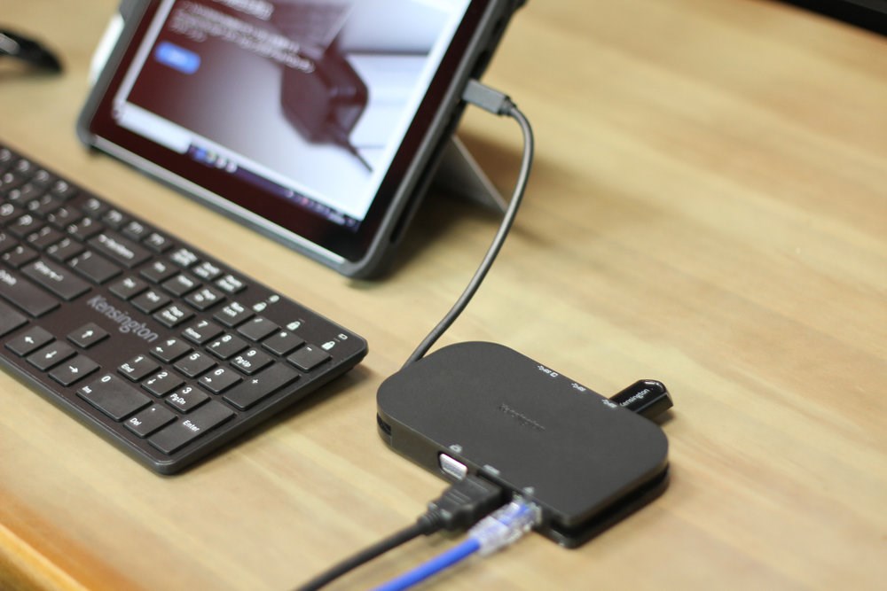 A Microsoft Surface tablet connected to a Kensington USB-C Mini Mobile Dock