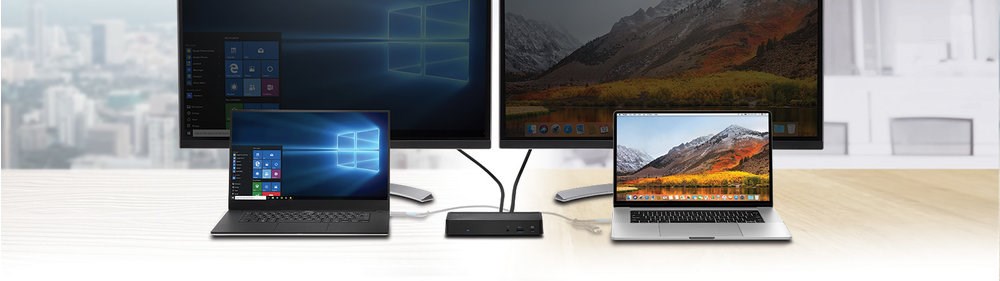 Two monitors and two laptops connected with a hybrid docking station