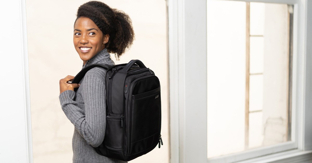 Woman wearing a Kensington laptop backpack 