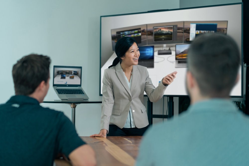Woman giving a presentation to two coworkers