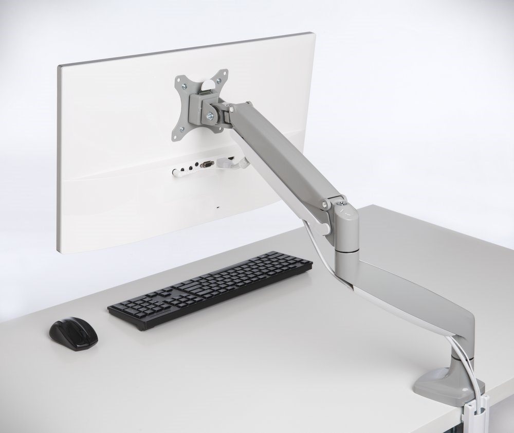 A Kensington monitor arm in use at a desk