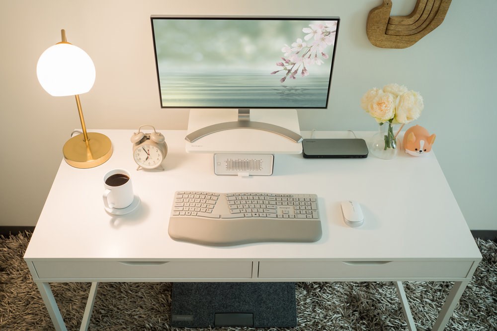 Desktop setup with a Kensington docking station and keyboard and mouse