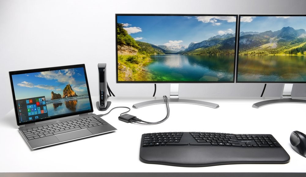 A dual monitor and laptop setup connected to a SD4100v 5Gbps USB 3.0 Dual 4K Docking Station