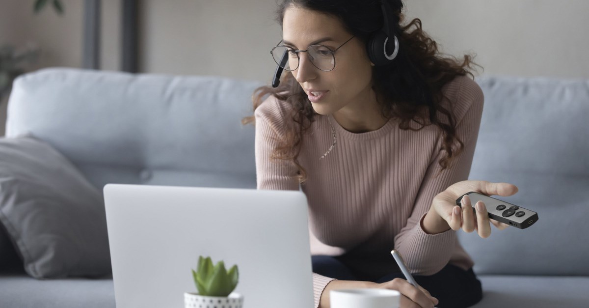 Woman giving a remote presentaiton on comptuer