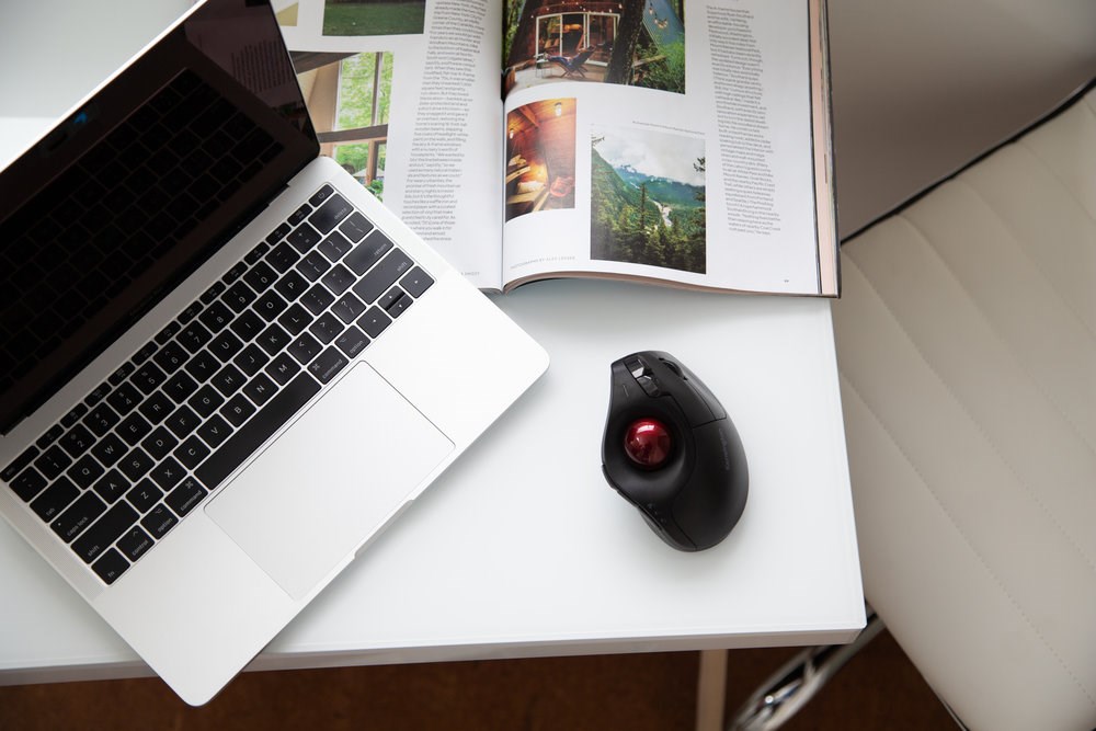 Laptop and a Kensington Pro Fit® Ergo vertical wireless trackball mouse