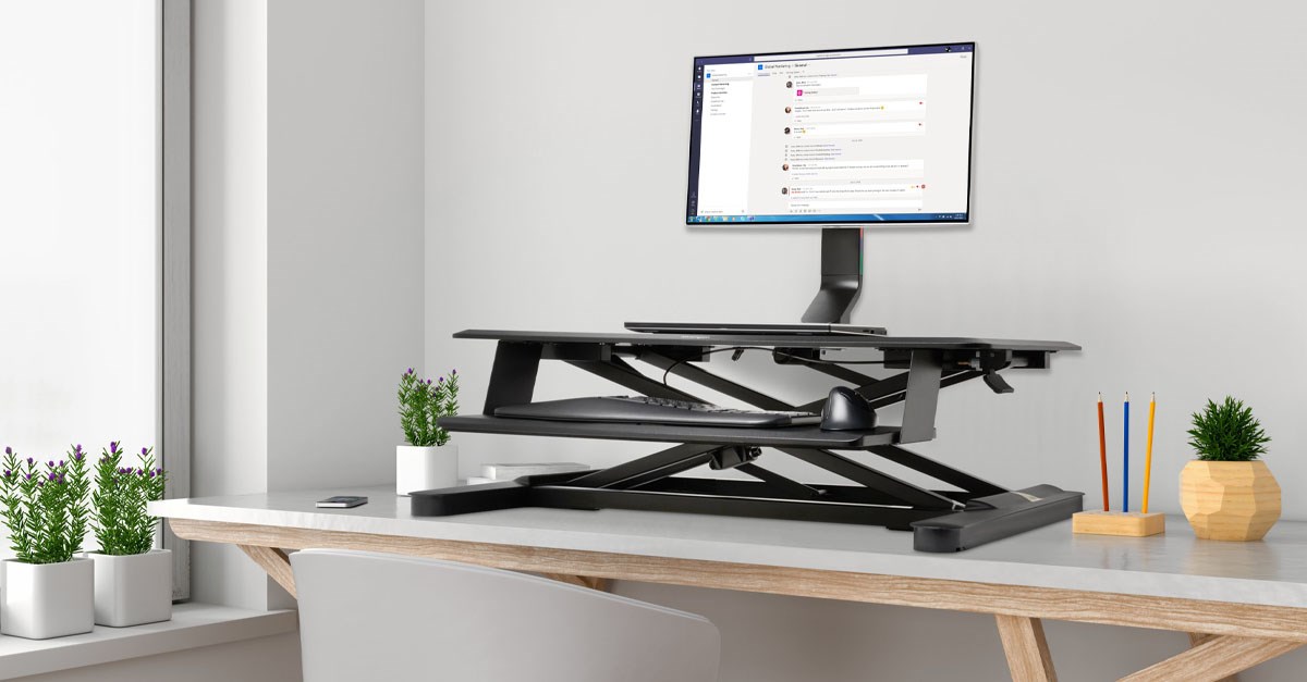 Home office desk setup with desktop riser