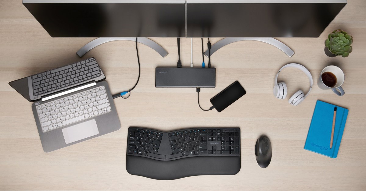 An organized workspace with a Kensington charging station