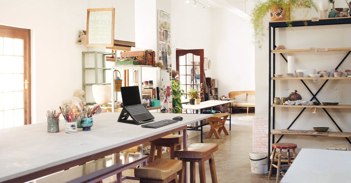 Laptop riser on desk of modern office