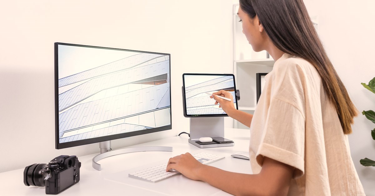 Woman using a Kensington StudioDock station