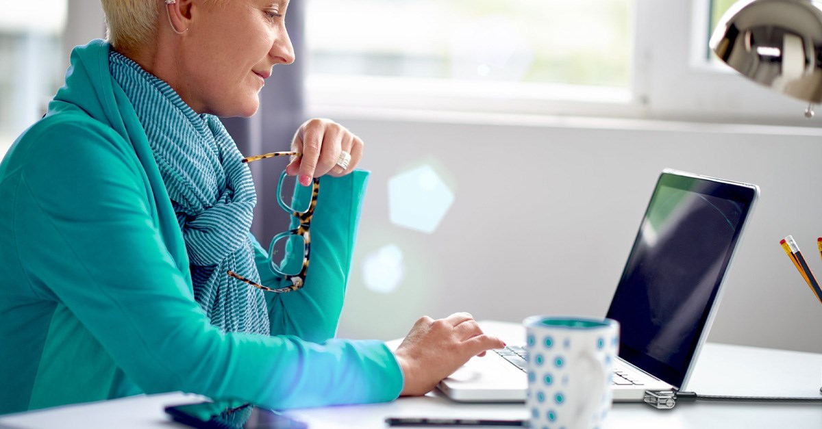 Woman at desk working on computer