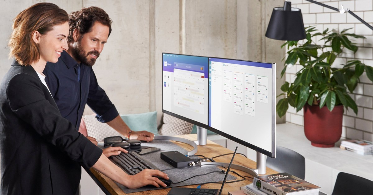 Woman and man working together at desk