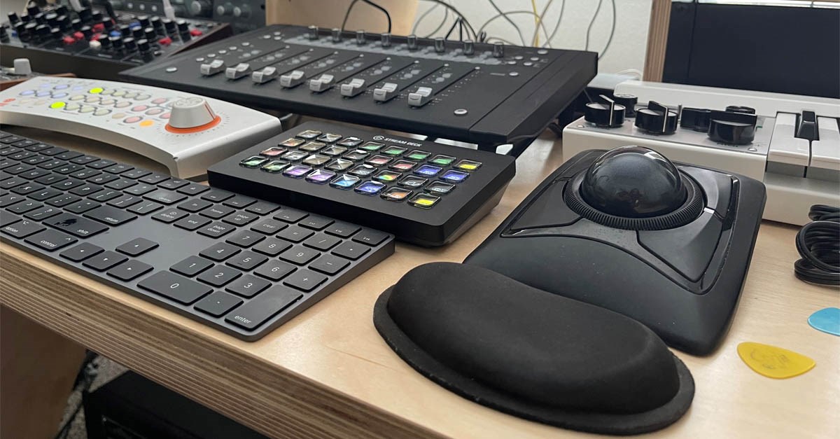 Kensington Expert Trackball on desk with sound equipment