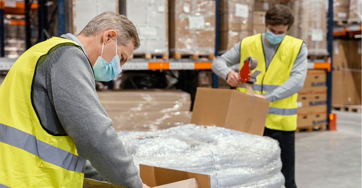 Workers packing with facemasks 