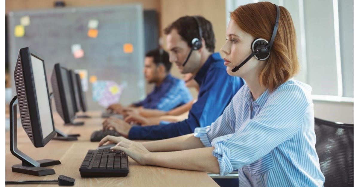 Office staff working on computers with Kensington VeriMark biometric access