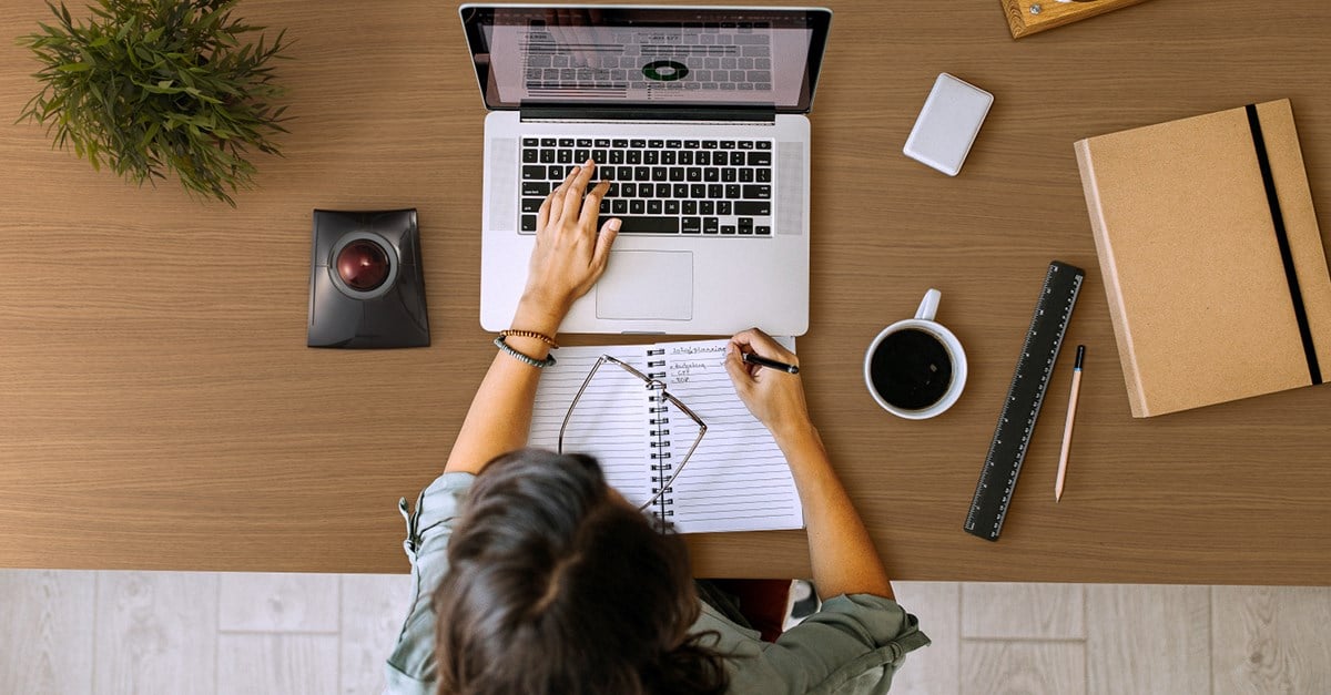 Person working with a Kensington SlimBlade Pro Wireless Trackball