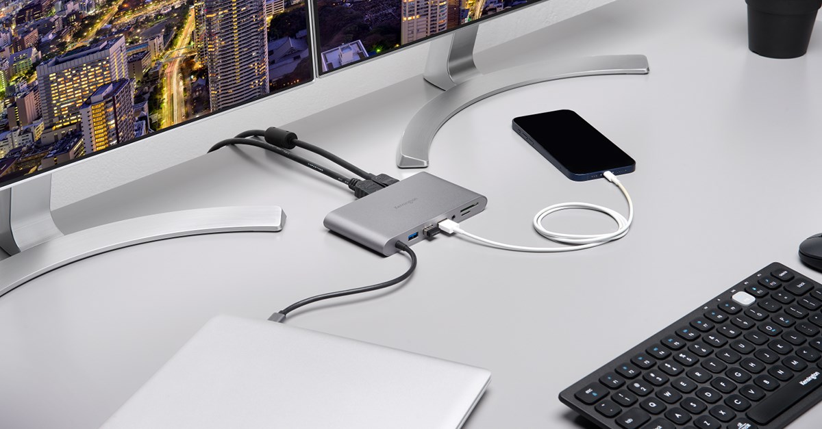 UH1440P Mobile Docking Station on a desk connecting two monitors and a laptop