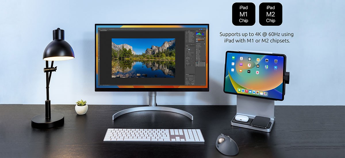 Kensington StudioDock with an iPad, placed next to a monitor on a black desk.