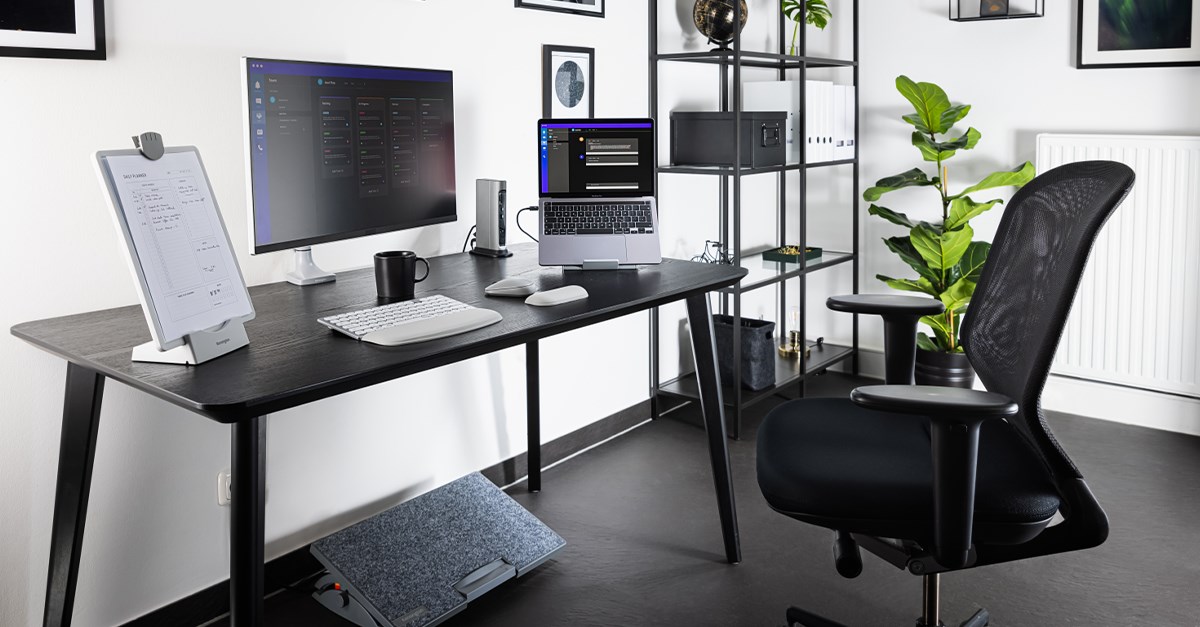 Ergonomic desk set up with wrist rest, laptop riser, monitor arm and footrest