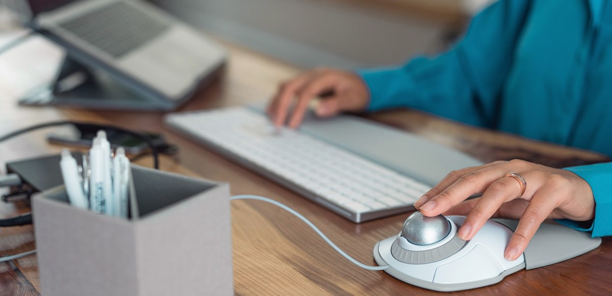 Set up with a Kensington trackball wrist rest and laptop riser