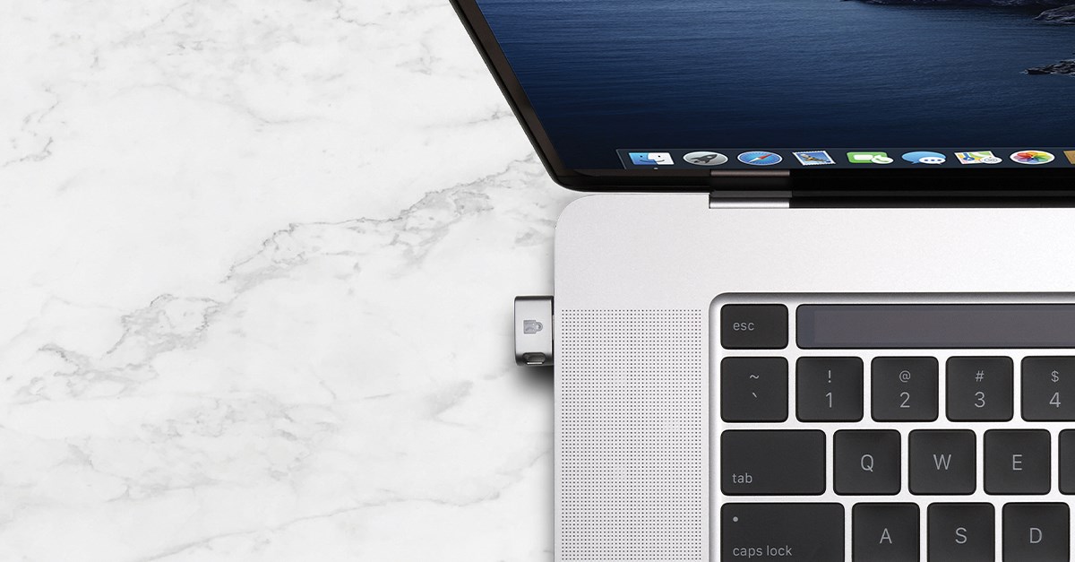 MacBook Pro with a Kenisngton VeriMark Finderprint Key.