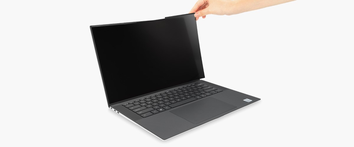  A privacy screen is placed on a laptop computer.