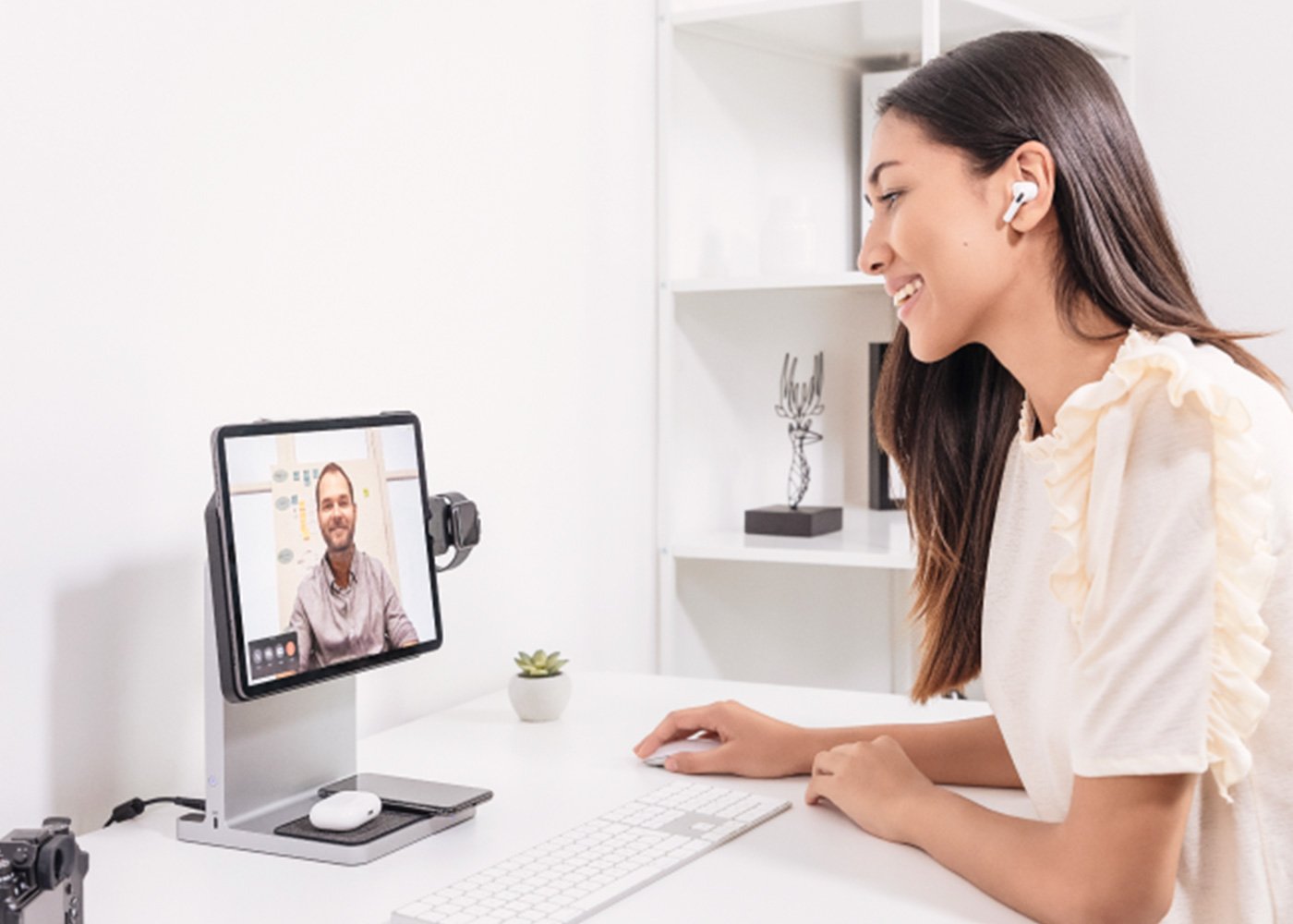 Woman in a meeting using a StudioDock.