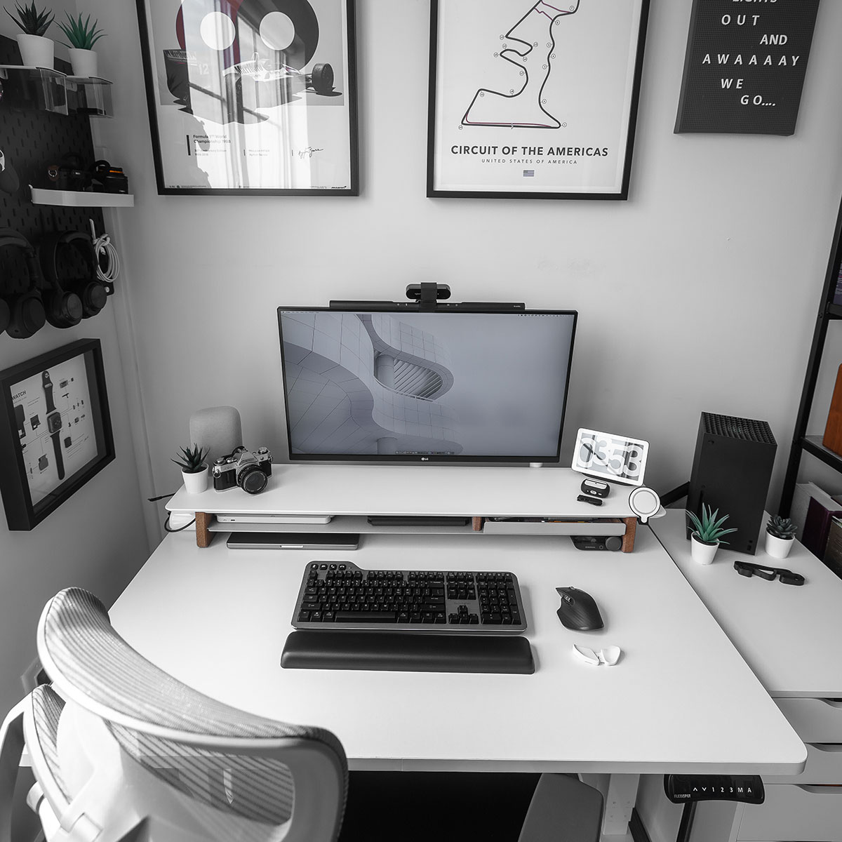 Cam DiCecca's desk with a Kensington Mechanical Keyboard and other computer accessories