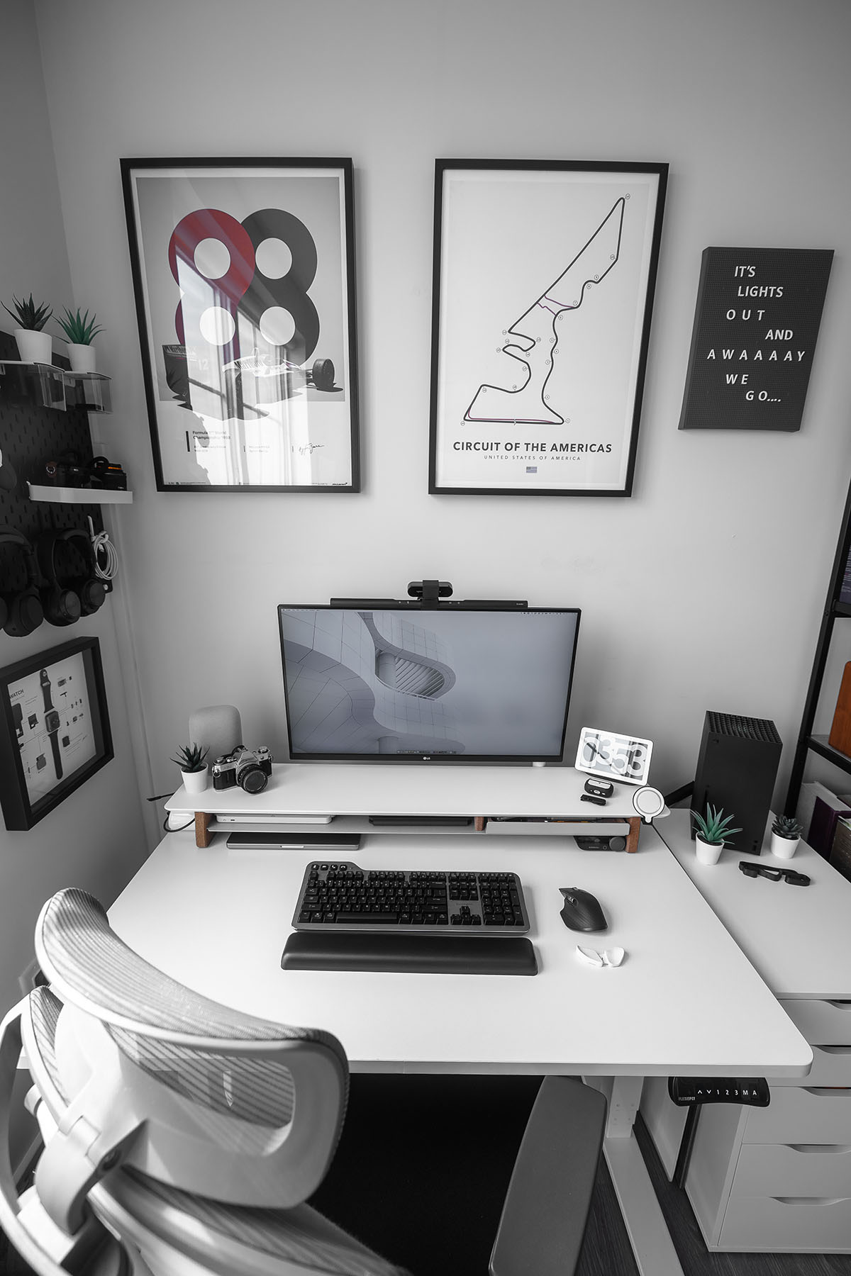 Cam DiCecca's desk with a Kensington Mechanical Keyboard and other computer accessories