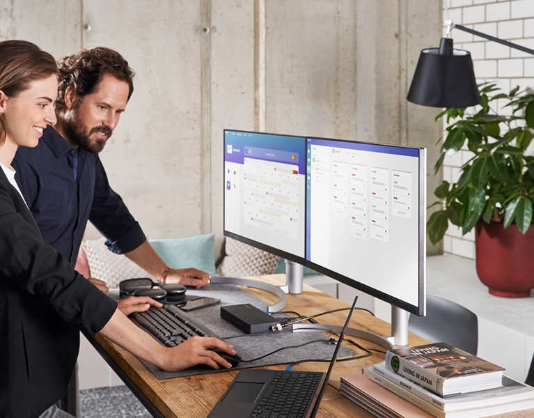 2 monitors and various devices connected with a Studio Dock.