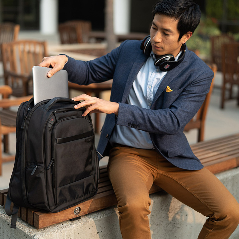 Man putting laptop into Kensington backpack