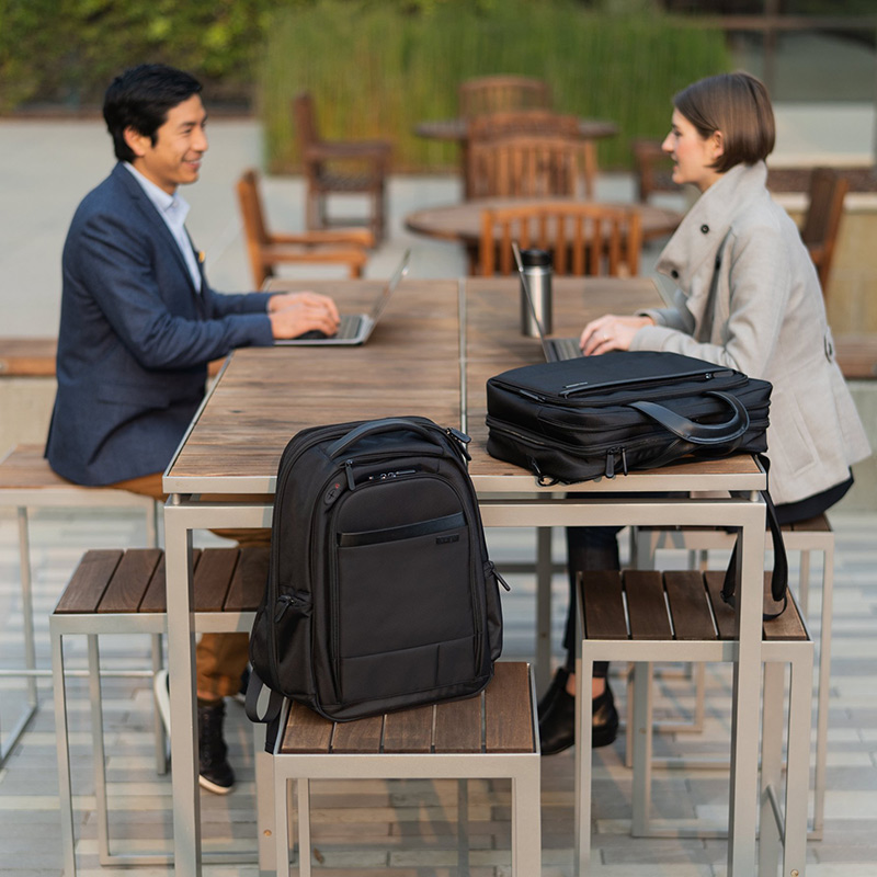 Two people working outside