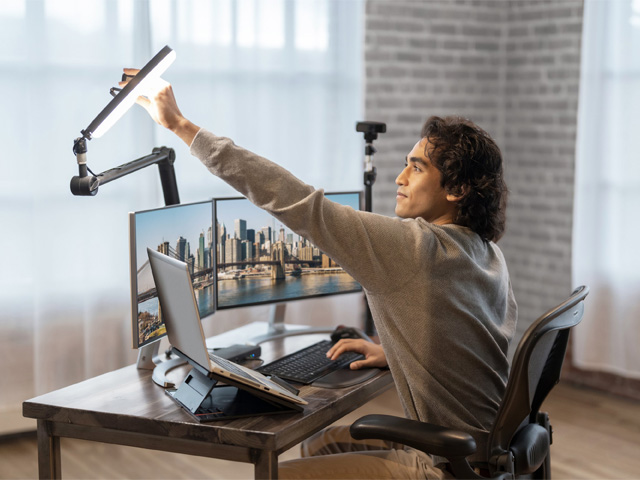 Man adjusting Kensington ring light