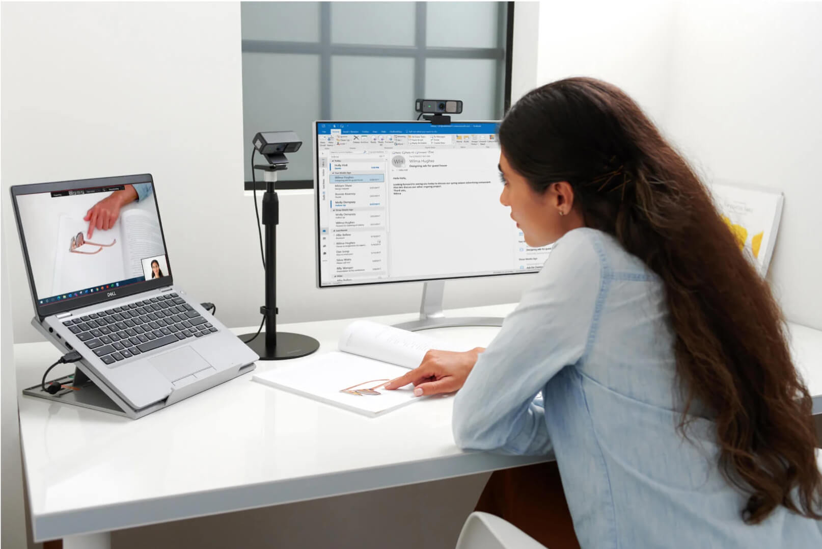 Dual webcam setup in a professional office space showcasing two Kensington W2050 Pro 1080P Auto Focus Webcams and a Kensington A1010 Telescoping Desk Stand
                        