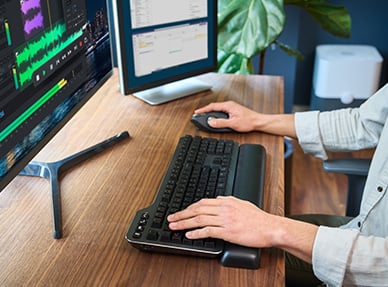 Person typing on MK7500F Silent Mechanical Keyboard.