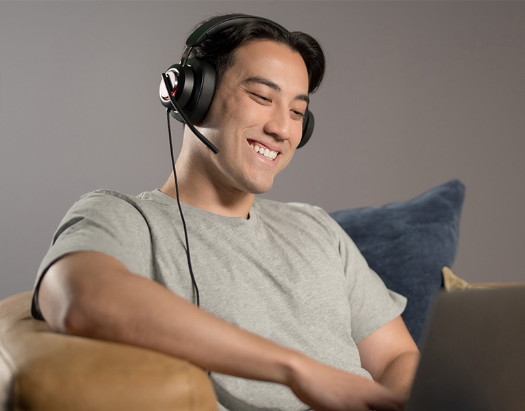 Man having a video conference wearing his H2000 headsets.